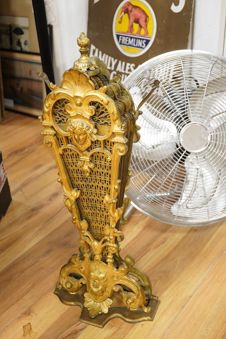 A 19th century cast gilt brass fan firescreen, 65cm high